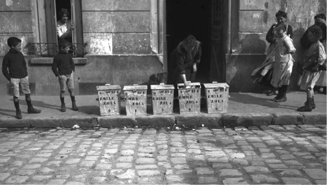 The first standardized bins on the streets of Paris, following the Poubelle decree of 1884